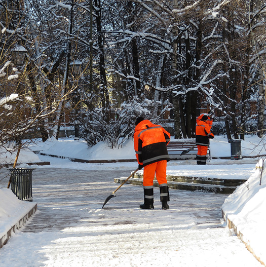 Photo of a workers removing a snow